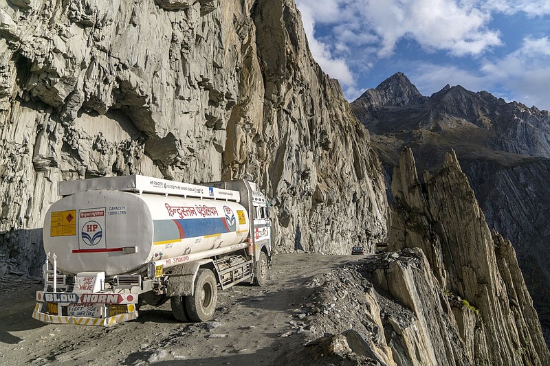 A Hindustan Petroleum Corp. tanker travels around the &quot;Captain Bend,&quot; where the cliff drops off nearly 820 feet, on the Zojila mountain pass in Kargil district, the Union Territory of Ladakh, India, on Sept. 23, 2021. MUST CREDIT: Bloomberg photo by