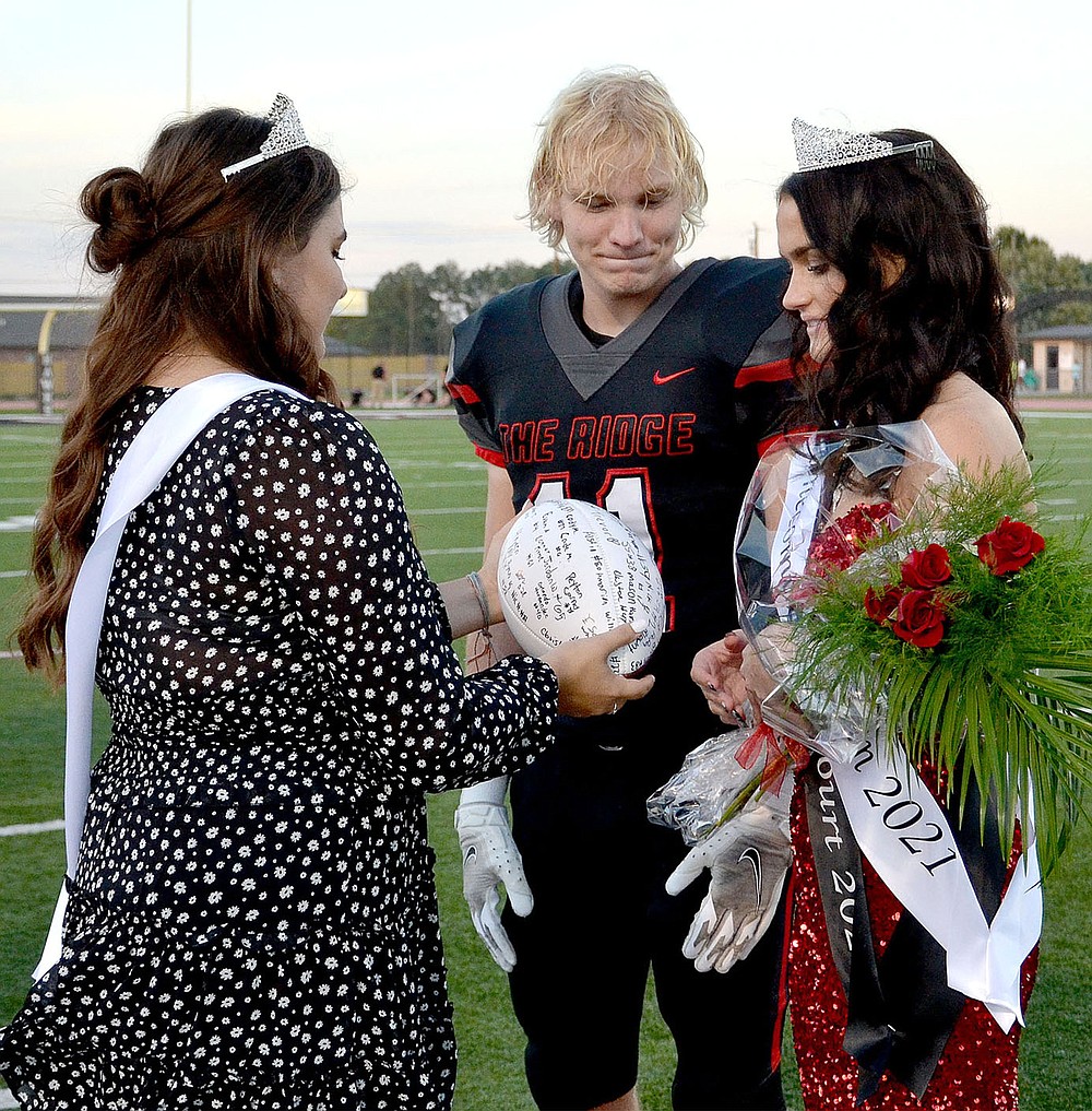 Blackhawk Homecoming Queen 2020 Gracie Easterling presented a signed football to Will Anderson and Paige Brown after she was announced as 2021 Homecoming Queen Friday, Oct. 8, 2021.