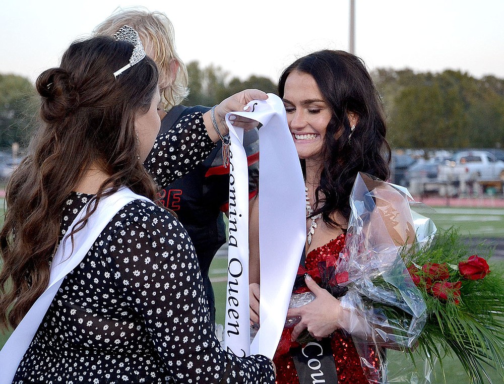 TIMES photograph by Annette Beard
Blackhawk Homecoming Queen 2020 Gracie Easterling placed a banner on Paige Brown, 2021 Homecoming Queen, before crowning her Friday night in Blackhawk Stadium.