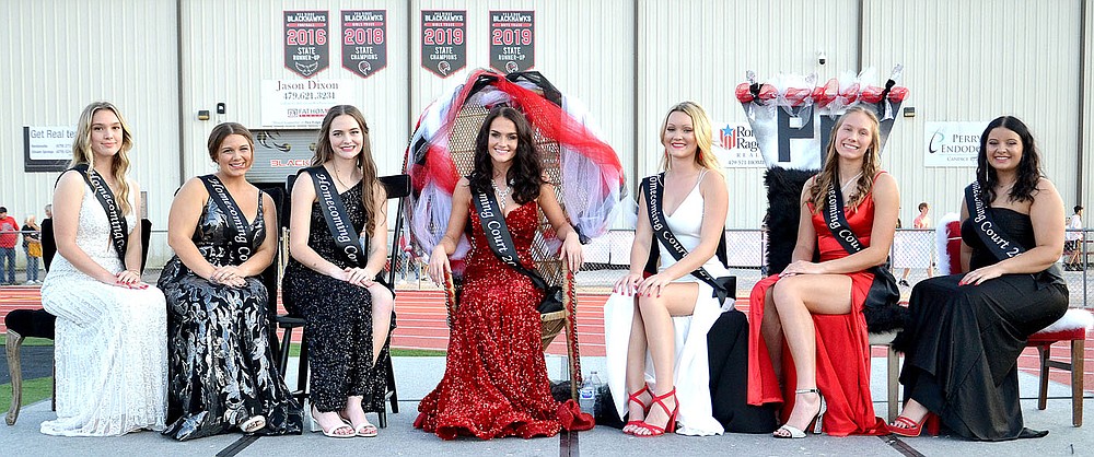 TIMES photograph by Annette Beard
The Blackhawk Homecoming maids, from left, Lillian Murray, Nalea Holliday, Lauren Wright, Paige Brown, Gabbie Fletcher, Dallice White and Marie Foltz posed before their presentation to the crowd in Blackhawk Stadium.