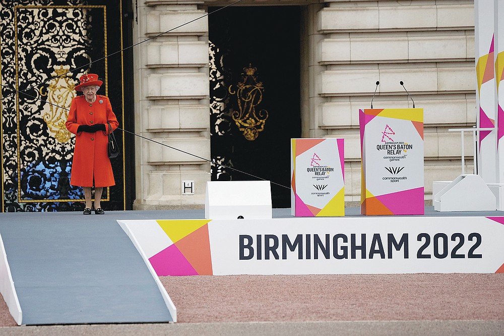 Britain's Queen Elizabeth II attends the Birmingham 2022 Commonwealth Games Queen's Baton Relay event outside Buckingham Palace in London, Thursday, Oct. 7, 2021. The city of Birmingham in England will host the 2022 Commonwealth Games. (AP Photo/Matt Dunham)