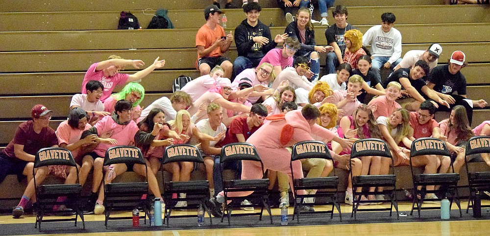 Westside Eagle Observer/MIKE ECKELS
As the pink bunny (center) points to his right, the Gravette pink student section bends over and point to their left during the break between sets of the Gravette-Gentry varsity volleyball contest in Gravette Thursday night.