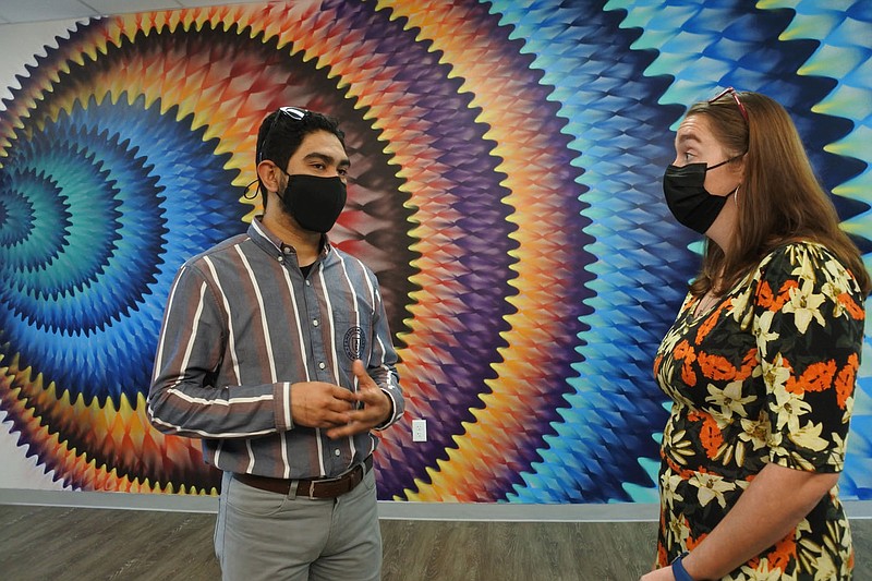 Israel Rodriguez (left) and Kristina Long talk in the Future School of Fort Smith's new building Friday. The school held a ribboncutting for the building. Go to nwaonline.com/211009Daily/ for today&#x201a;&#xc4;&#xf4;s photo gallery.
(NWA Democrat-Gazette/Thomas Saccente)