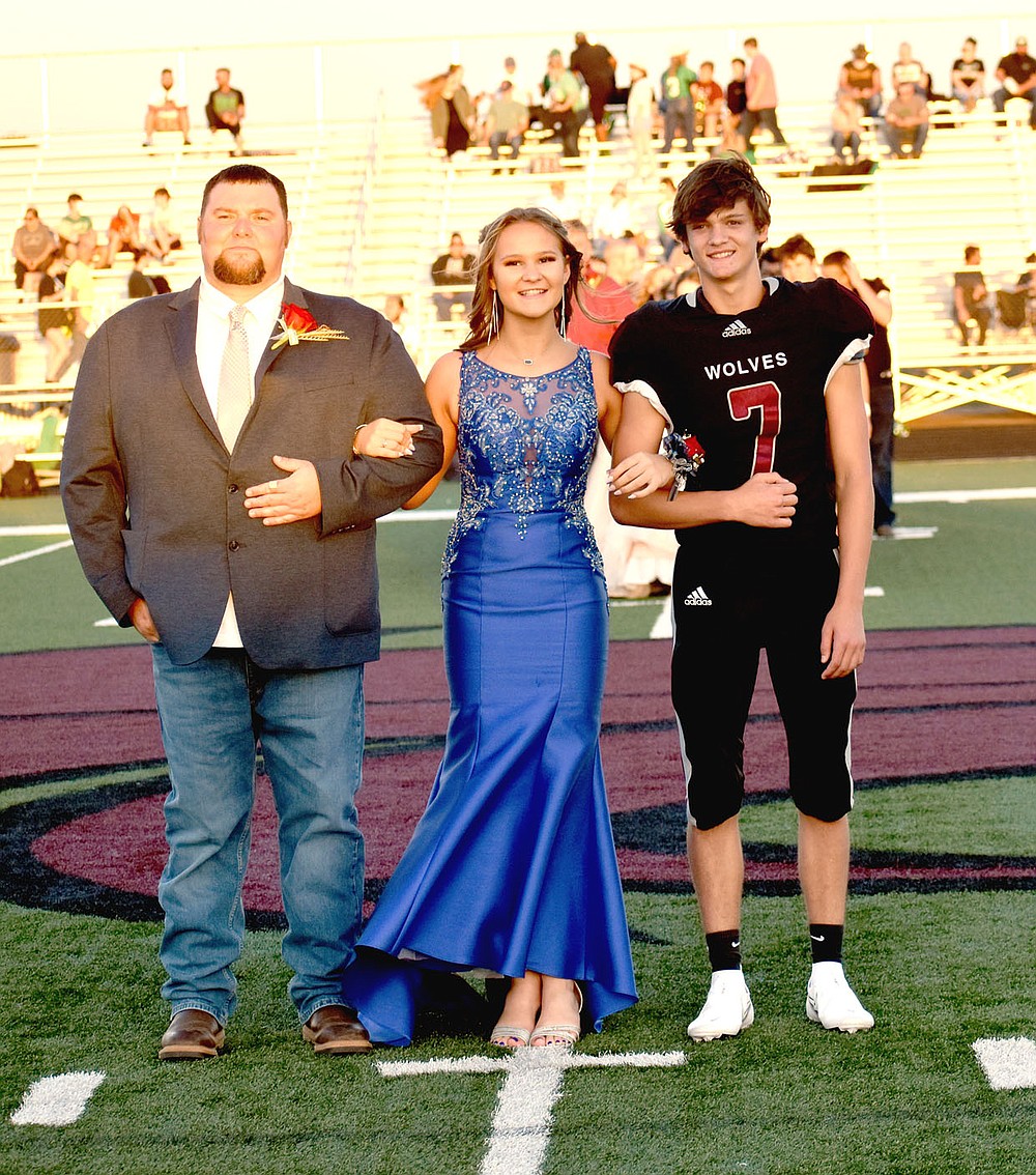 MARK HUMPHREY ENTERPRISE-LEADER/Lincoln sophomore Addie Pershall escorted by Casey Pershall and Trace Wallace.