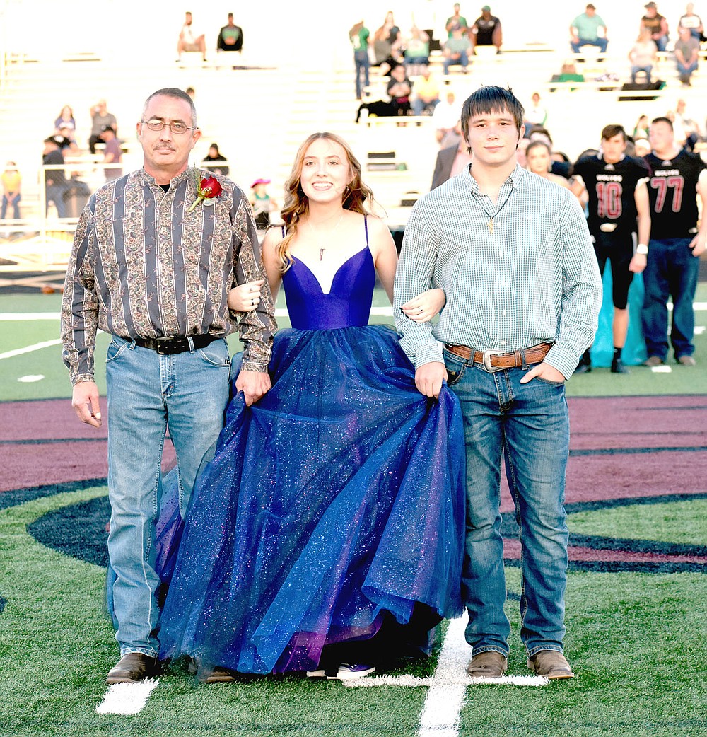 MARK HUMPHREY ENTERPRISE-LEADER/Lincoln junior maid Randi Kistler escorted by her dad and senior Caleb Matthews.