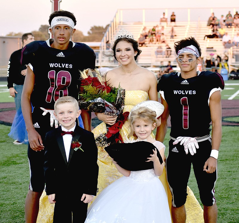 MARK HUMPHREY  ENTERPRISE-LEADER/Lincoln 2021 Homecoming queen Emily Meckley, escorted by seniors A.J. Garner (left) and Rafael Regado, accompanied by 
attendants, Maverick Umberson and Bexlee Price.