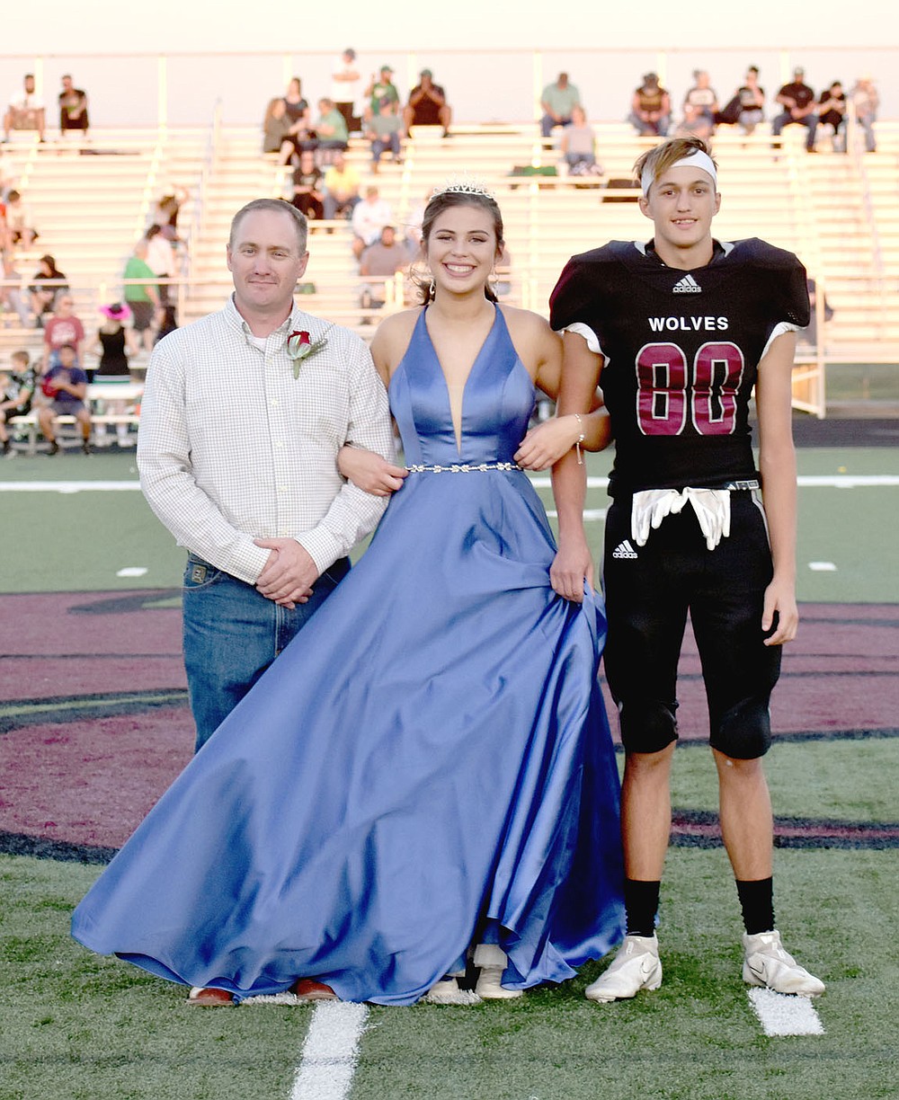 MARK HUMPHREY ENTERPRISE-LEADER/Lincoln senior Aylissa White, daughter of Jeremy and Kim White. escorted by her uncle Heath Jones and senior Brennin Davis.