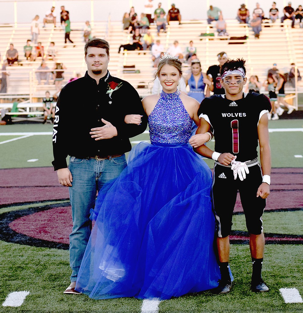 MARK HUMPHREY ENTERPRISE-LEADER/Lincoln senior maid Destiny Rochier escorted by her brother and senior Rafaela Regaldo.