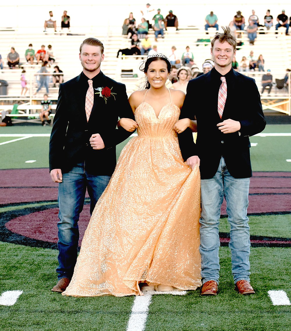 MARK HUMPHREY ENTERPRISE-LEADER/Lincoln senior Katie Jones escorted by twin brothers, Brodey (left) and Blake Bowen.