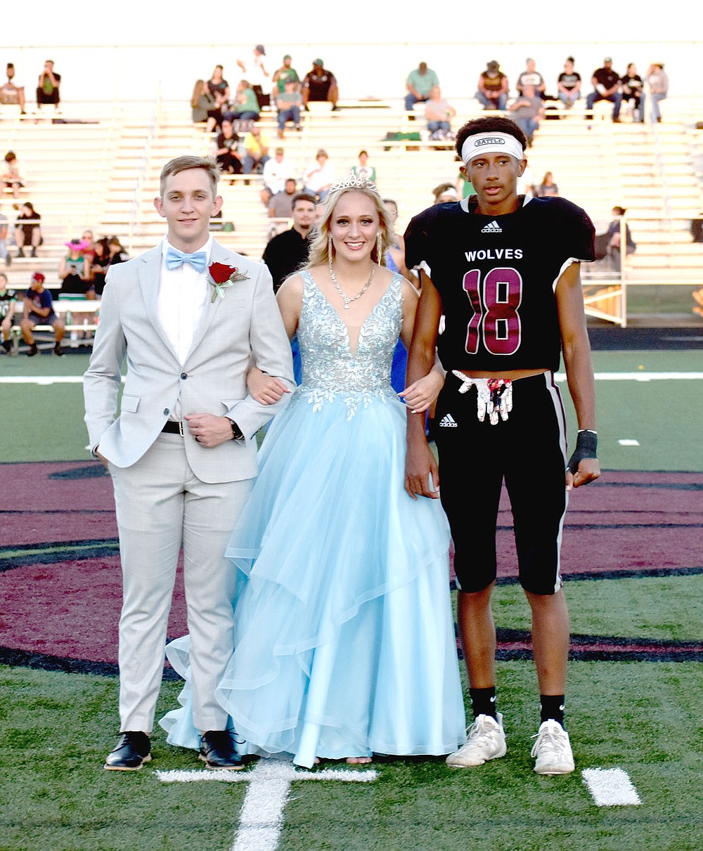 MARK HUMPHREY ENTERPRISE-LEADER/Lincoln senior maid Lorinda Miller, daughter of Ed and Mary Miller, escorted by her brother, Lyndon Miller, and senior A.J. Garner.