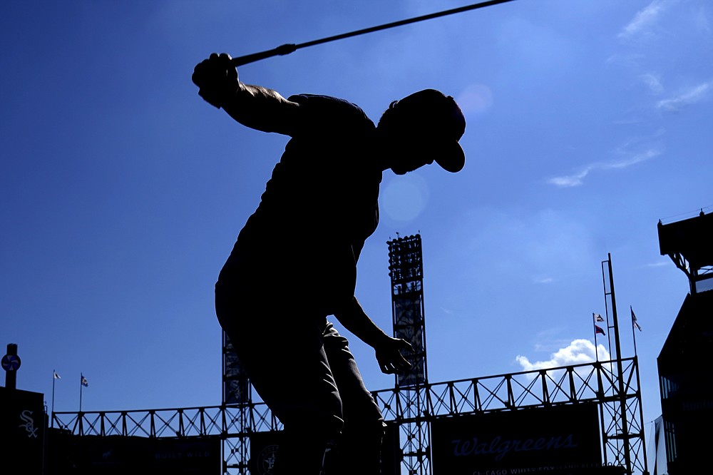 Houston Astros' Garrett Stubbs warms up during baseball practice for the American League Division Series, Saturday, Oct. 9, 2021, in Chicago. The Chicago White Sox host the Astros in Game 3 on Sunday. (AP Photo/Nam Y. Huh)