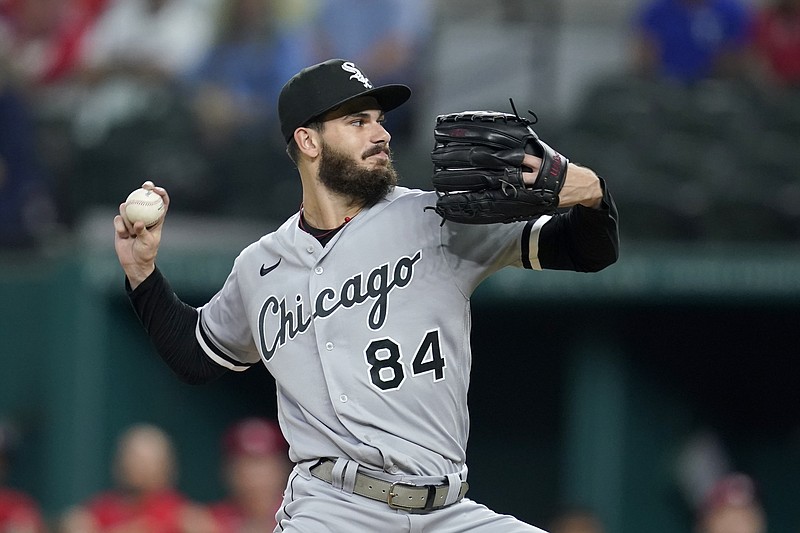 Chicago White Sox starting pitcher Dylan Cease winds up to throw to a Texas Rangers batter during the first inning of a baseball game in Arlington, Texas, Friday, Sept. 17, 2021. (AP Photo/Tony Gutierrez)