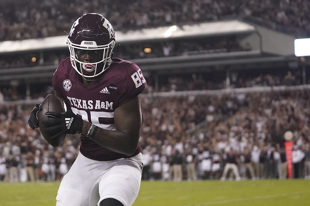 Texas A&M tight end Jalen Wydermyer catches a pass for a touchdown against Alabama during the first half of an NCAA college football game Saturday, Oct. 9, 2021, in College Station, Texas. (AP Photo/Sam Craft)