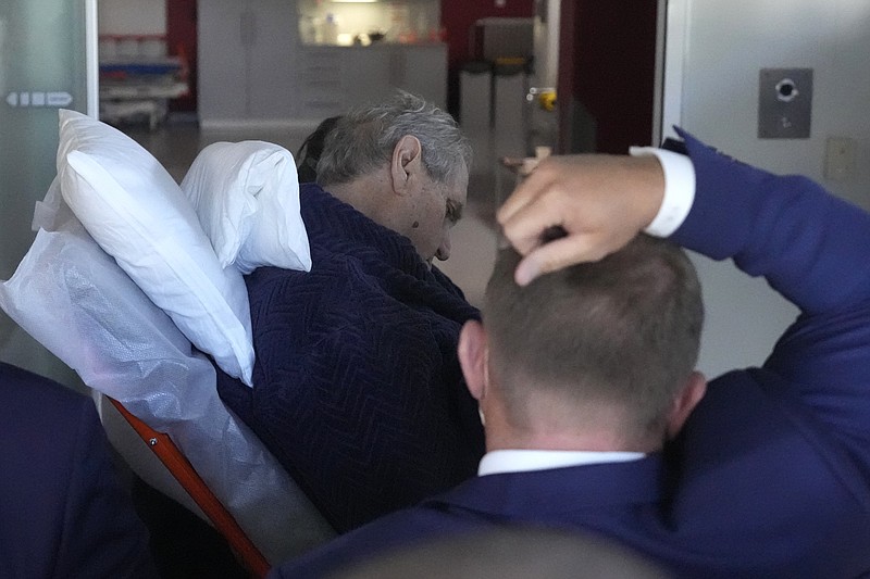 Czech Republic's President Milos Zeman is admitted to the Military hospital in Prague, Czech Republic, Sunday, Oct. 10, 2021. Zeman is a heavy smoker who has suffered from diabetes and neuropathy linked to it. He has trouble walking and has been using a wheelchair. (AP Photo/Petr David Josek)