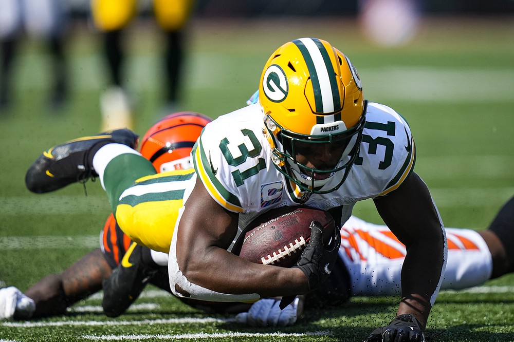 Green Bay Packers safety Adrian Amos (31) dives forward after an interception against the Cincinnati Bengals in the second half of an NFL football game in Cincinnati, Sunday, Oct. 10, 2021. (AP Photo/AJ Mast)