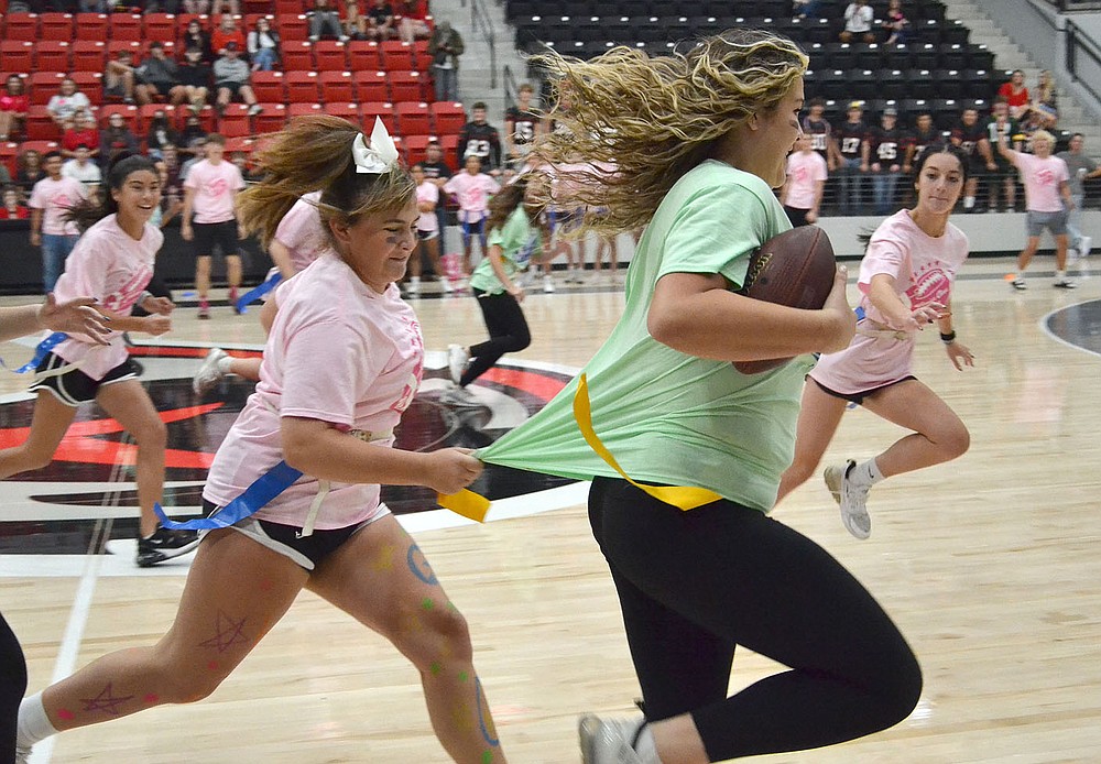 Powder Puff flag football was senior girls against junior girls Friday morning in Blackhawk gym.