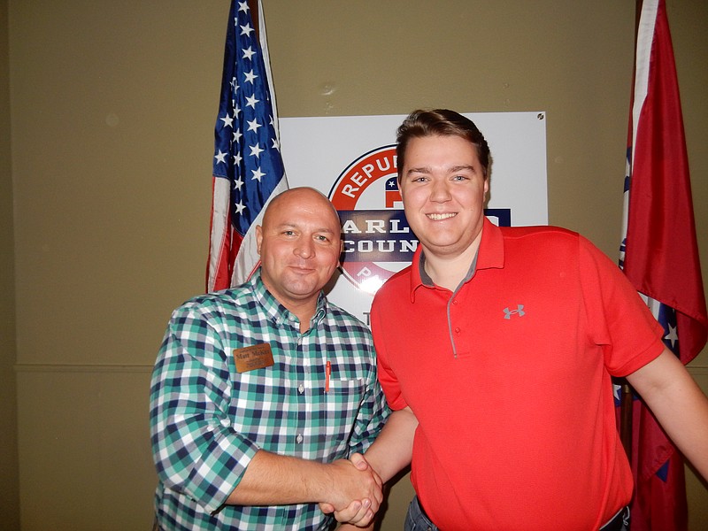 Dayton Myers, right, of Hot Springs, shakes hands with RPGC Chairman Matt McKee. - Submitted photo