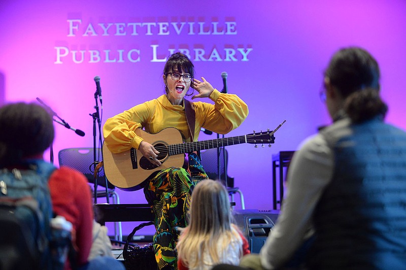 NWA Democrat-Gazette/ANDY SHUPE
Musician Shannon Wurst of Fayetteville performs Saturday, Nov. 2, 2019, during the Super Saturday: Music with Shannon Wurst at the Fayetteville Library. Wurst played songs for a large crowd during the weekly series of events and shows.