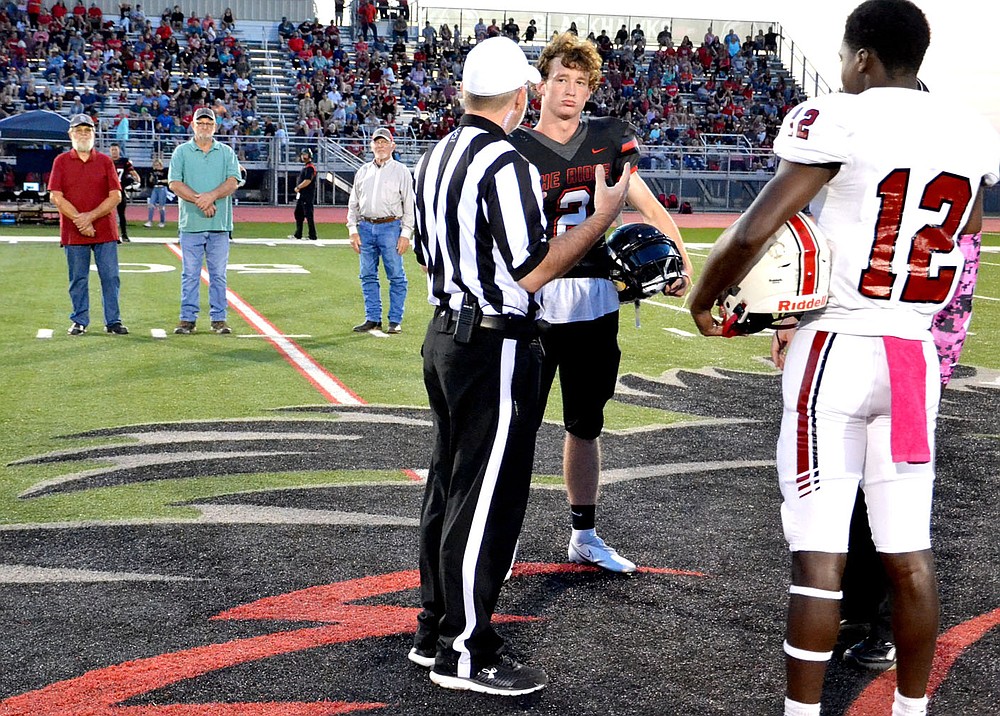TIMES photograph by Annette Beard
Blackhawk football captain Joe Adams, No. 2, met in center field for the coin toss as honorary captains J.C. Beaver, Steve Patton and Doug McKinney looked on. The honorary captains were members of the1963 Blackhawk football team as the first Pea Ridge football team in school history.