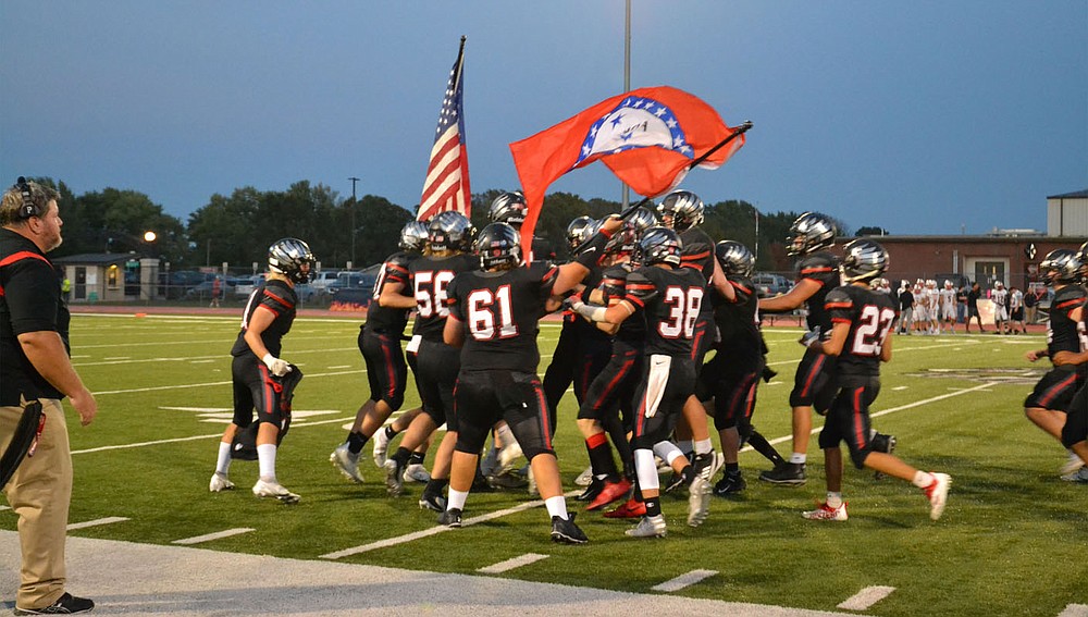 Blackhawks enthusiastically waved the flags immediately after running onto the field Friday, Oct. 8, for the homecoming game against the Vilonia Eagles, who won the contest 35-0.