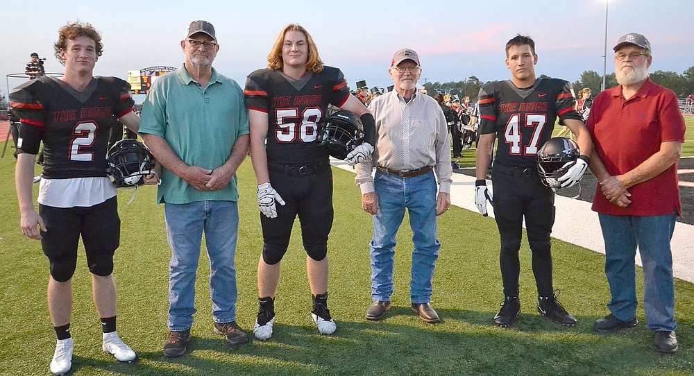 TIMES photograph by Annette Beard
Blackhawk football captains and honorary captains for the Homecoming football game Friday, Oct. 8, were Joe Adams, No. 2, Steve Patton, Clay Sebree, No. 58, Doug McKinney, Clayton Henson, No. 47, and J.C. Beaver. The honorary captains were members of the first Blackhawk football team in 1963.