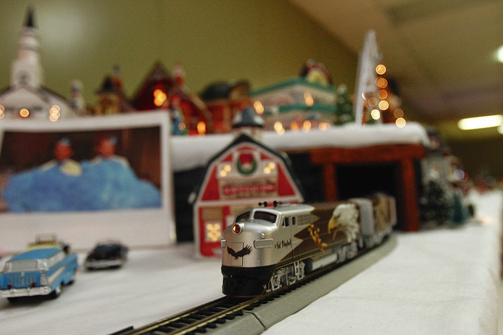 Paul Smith wires Christmasville to include any lights, sounds, or movements that buildings and miniature figures are capable of. (News-Times file)