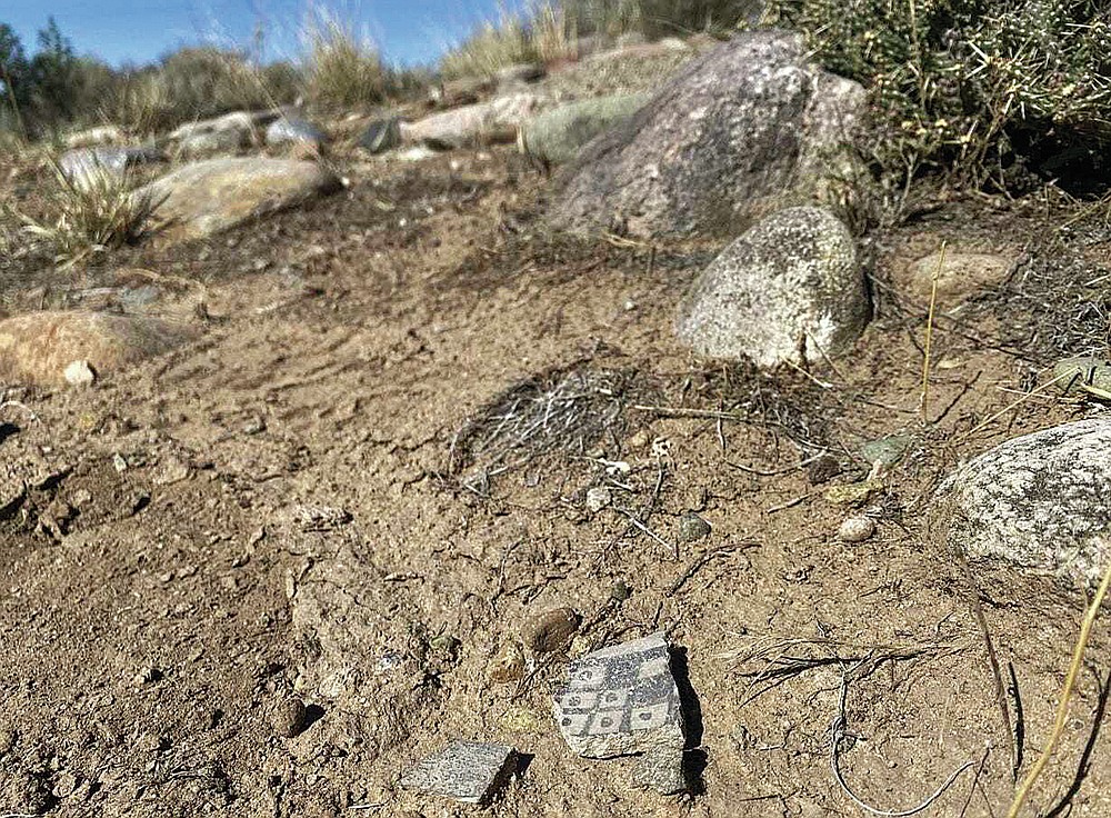 This Saturday, Sept. 25, 2021, photo shows a pottery shard at Aztec North, an unexcavated great house at Aztec Ruins National Monument near Aztec, N.M. (Noel Lyn Smith/The Daily Times via AP)