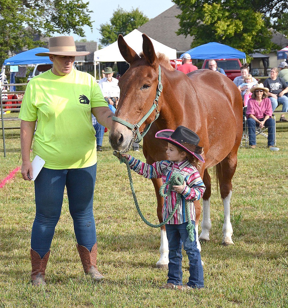 Cyndi Nelson and one of the youngest competitors waited for their turn to be judged in the halter judging.