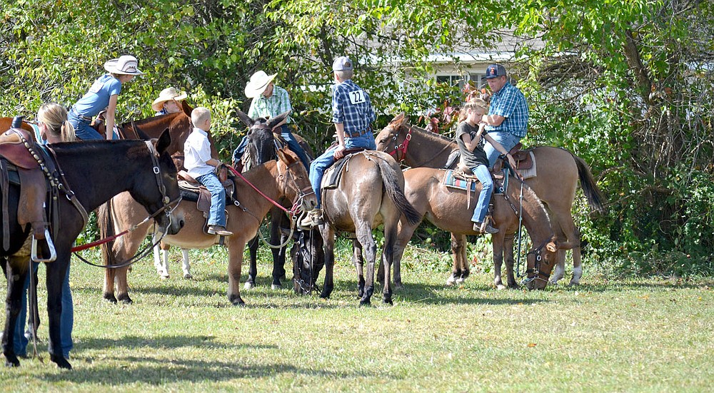 When not in the arena, mules and their riders waited and visited.
