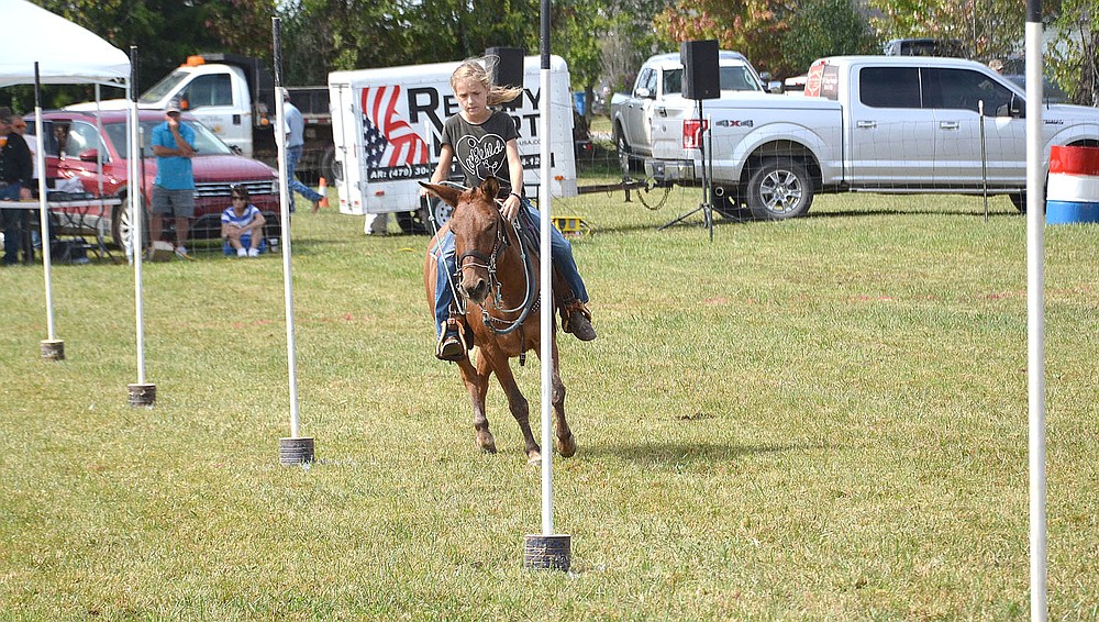 Pole bending is one of the many speed events for competitors at the mule jump.