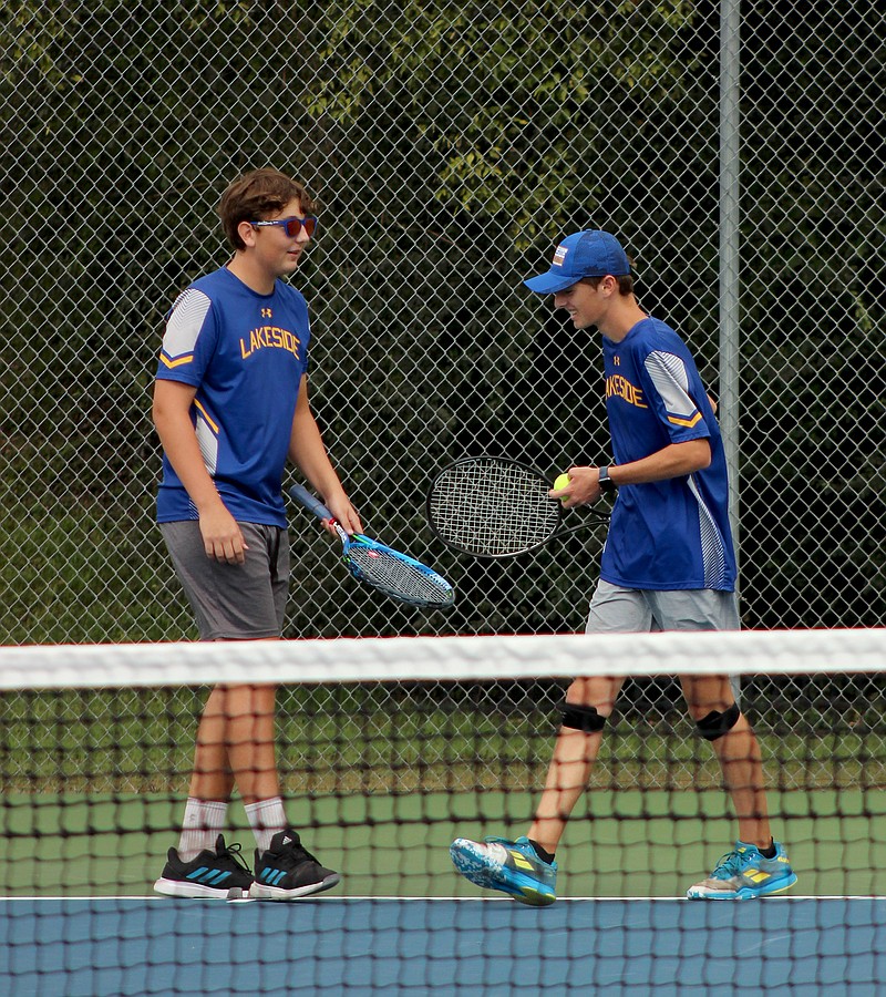 Lakeside’s Greyson Cornelison, left, and Walker Wood congratulate each other after winning a point during their doubles match against Beebe's Lucas Young and Abram Chapman at Hot Springs Country Club Monday. The pair advanced to today's semifinal round, which will be played at Lakeside High School. - Photo by James Leigh of The Sentinel-Record