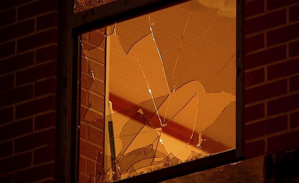 In this image made from video, broken widows from tornadoes are seen on a building late Sunday, Oct. 10, 2021, in Norman, Oklahoma. Several reported tornadoes ripped through Oklahoma late Sunday into early Monday morning, causing damage but no immediate word of deaths or injuries. (KWTV via AP)