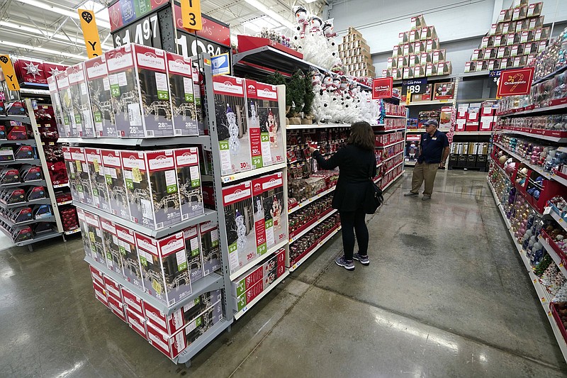 FILE - In this Nov. 9, 2018, file photo Christmas decorations are shown at a Walmart Supercenter in Houston. Timing is everything when it comes to saving for the holidays. The longer you have to build up cash reserves, plan your budget and buy gifts at the right price, the better you can cover these seasonal costs without going into debt.