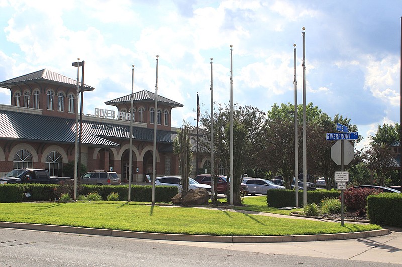 Empty flagpoles at Riverfront Park in Fort Smith are seen in this June 3, 2021 file photo. The flagpoles were installed in 2001 for the Flags over Fort Smith display, featuring the seven historic flags that have flown over the city, including the Confederate flag. (File Photo/NWA Democrat-Gazette)