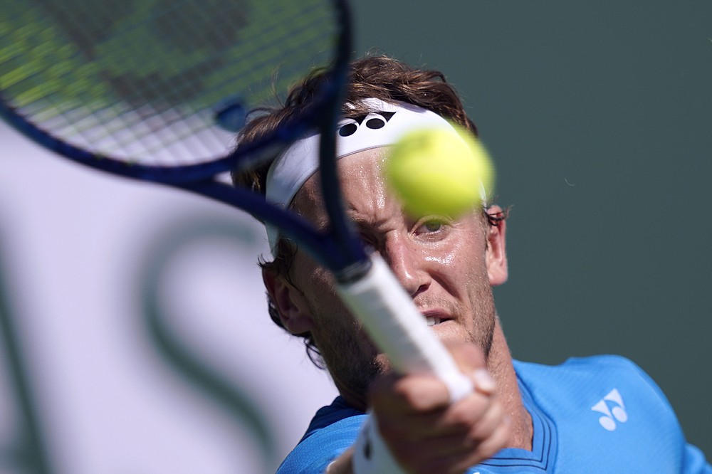 Casper Ruud, of Norway, returns to Lloyd Harris, of South Africa, at the BNP Paribas Open tennis tournament Monday, Oct. 11, 2021, in Indian Wells, Calif. (AP Photo/Mark J. Terrill)