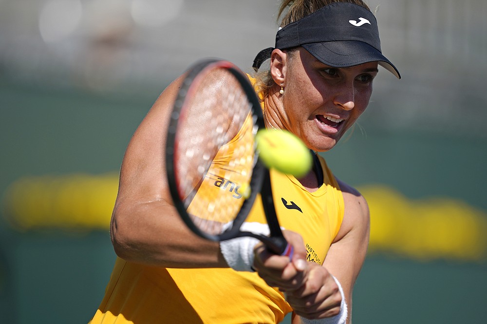 Beatriz Haddad Maia, of Brazil, returns to Karolina Pliskova, of the Czech Republic, at the BNP Paribas Open tennis tournament Monday, Oct. 11, 2021, in Indian Wells, Calif. (AP Photo/Mark J. Terrill)