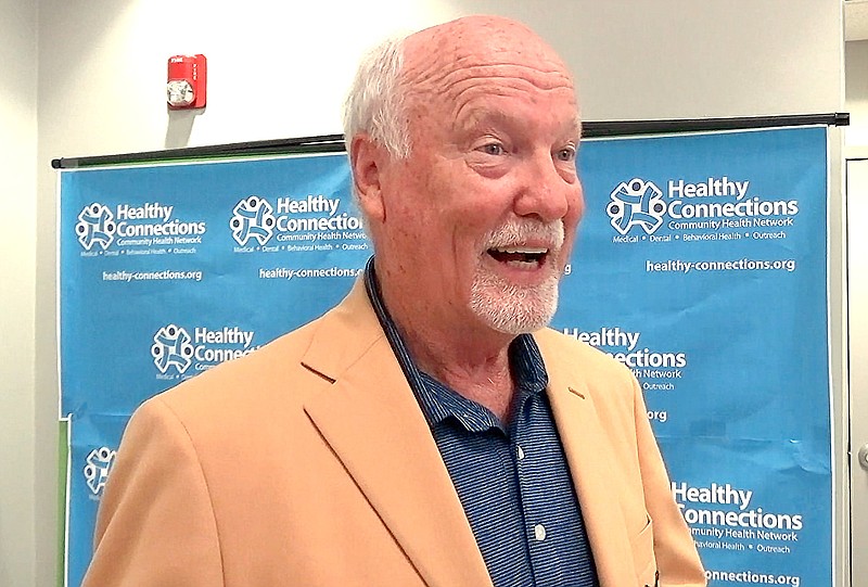 Pro Football Hall of Famer Cliff Harris promotes COVID-19 vaccinations Tuesday during an appearance at Healthy Connections on Central Avenue. - Photo by Tyler Wann of The Sentinel-Record