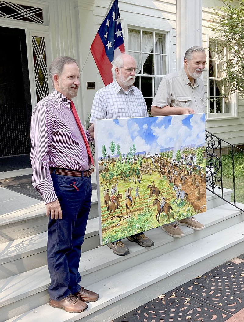 PHOTO BY MAYLON RICE SPECIAL TO ENTERPRISE-LEADER
Jim Spillars, left, the outgoing president of Washington County Historical Society, is joined by Jerry Hogan (center) and artist Daniel Hoffbauer  (right) of Bella Vista as the new painting of the Battle of Fayetteville was presented to Spillars at the Headquarters House Museum in Fayetteville. Hoffbauer, with the help of Hogan and Spillars, made the painting as near to historical accuracy as possible. Spillars served as president for two years.