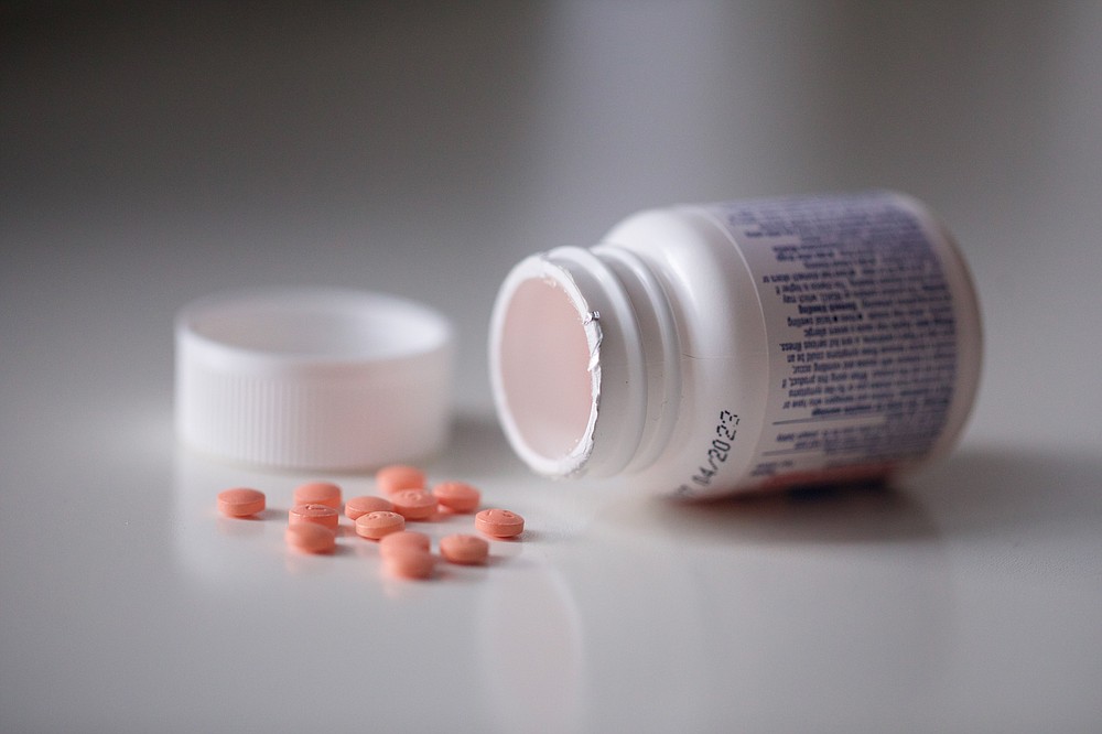 This Friday, Oct. 15, 2021 photo shows a bottle of aspirin in the Brooklyn borough of New York. According to the U.S. Preventive Services Task Force's preliminary updated advice released on Tuesday, Oct. 12, 2021, older adults without heart disease shouldn't take daily aspirin to prevent a first heart attack or stroke. (AP Photo/Emma H. Tobin)