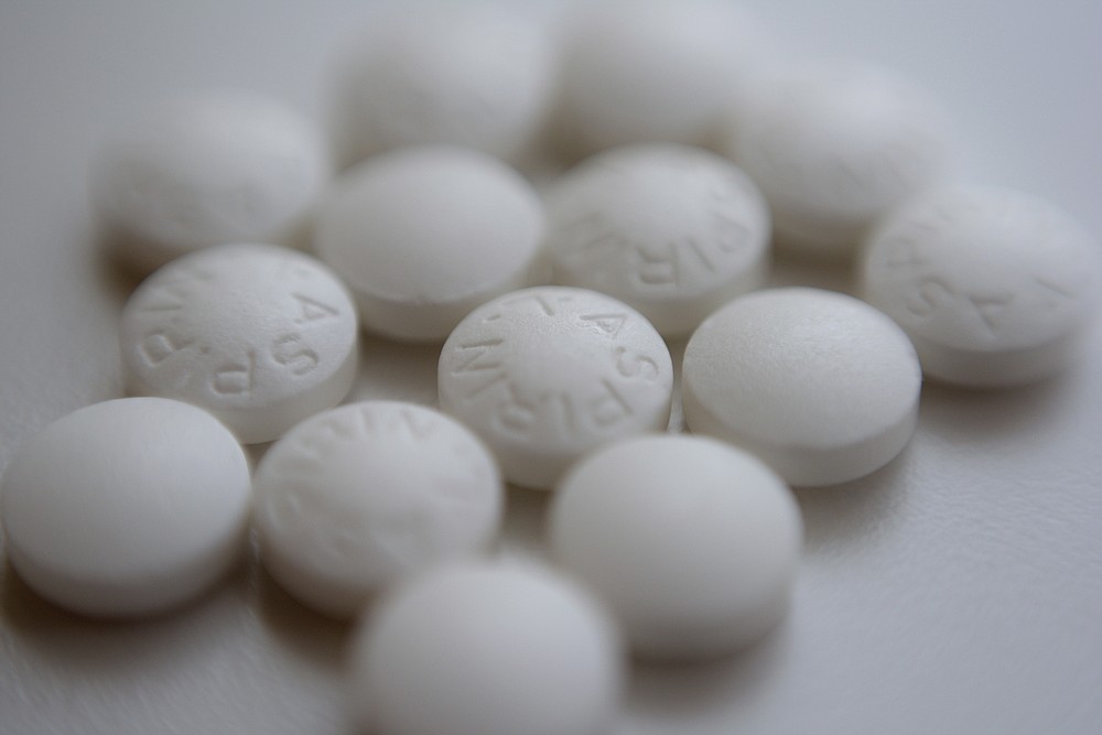 FILE - This Aug. 23, 2018 file photo shows an arrangement of aspirin pills in New York. Older adults without heart disease should not take daily aspirin to prevent a first heart attack or stroke. That's according to preliminary updated advice from an influential health guidelines group. The draft guidance posted online Tuesday, Oct. 12, 2021 by the U.S. Preventive Services Task Force back tracks a bit but puts the panel more in line with other medical groups. (AP Photo/Patrick Sison, File)