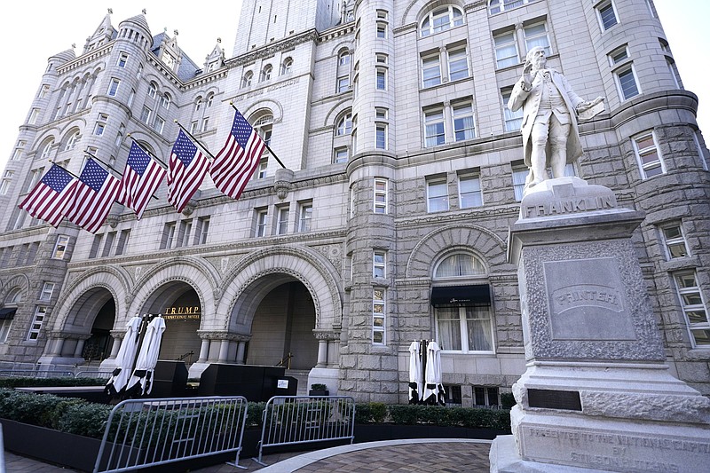 FILE- The Trump International Hotel on Pennsylvania Avenue is seen on March 4, 2021, in Washington. Former President Donald Trump's company lost more than $70 million operating his Washington D.C. hotel while in office, forcing him at one point get a reprieve from a major bank on payments on a loan, according to documents released Friday, Oct. 8, by a House committee investigating his business. (AP Photo/Julio Cortez, File)