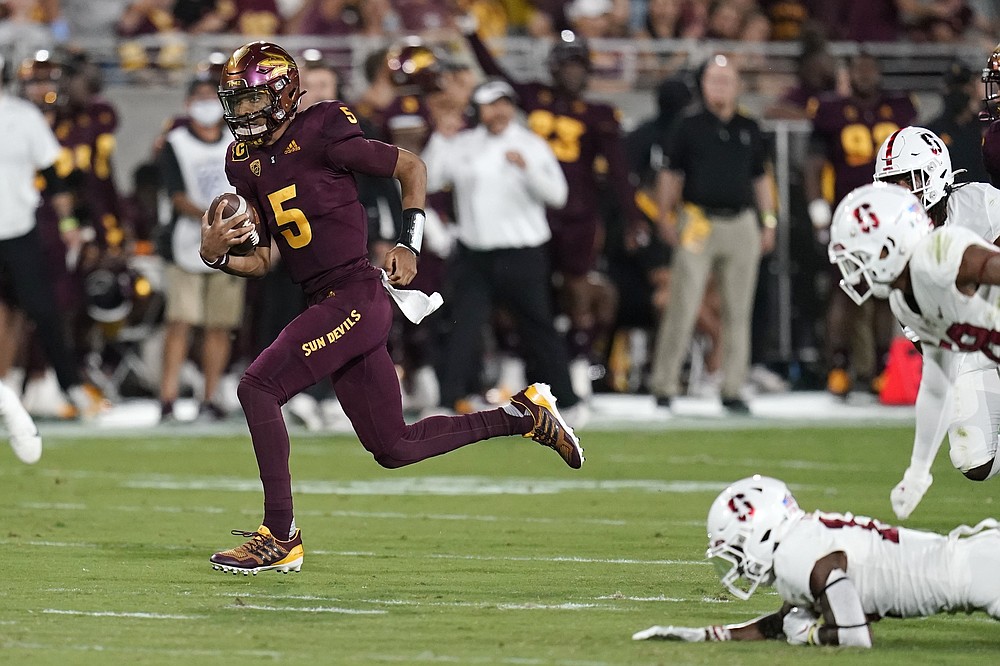 Arizona State quarterback Jayden Daniels (5) gets past the Stanford defense as he runs for a touchdown during the first half of an NCAA college football game Friday, Oct. 8, 2021, in Tempe, Ariz. (AP Photo/Ross D. Franklin)