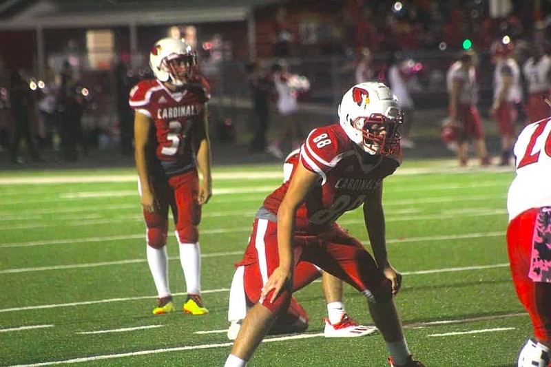 Photo By: Patric Flannigan
Cardinals defensive end Kameron Easttam gets ready to block for a PAT
