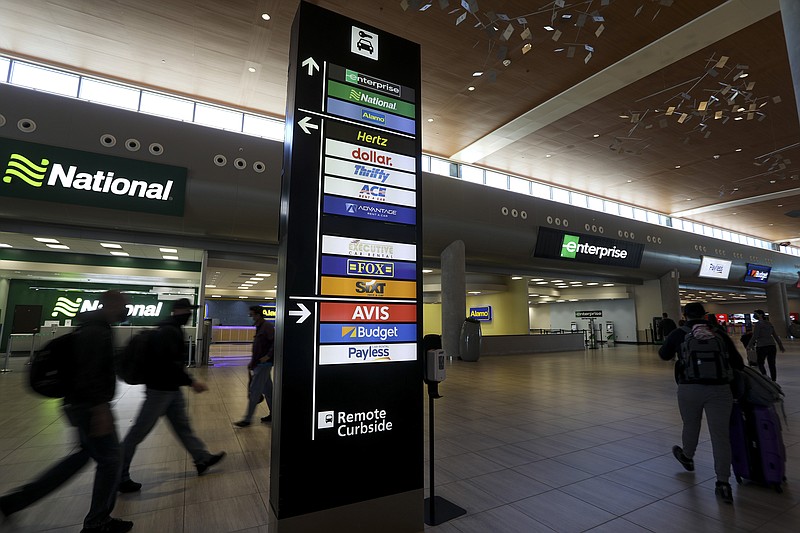 Travelers walk inside Tampa International Airport's Rental Car Center in Tampa, Florida, on March 19, 2021. Some travel industry analysts say that the car rental crisis of the past few months has come to an end. (Ivy Ceballo/Tampa Bay Times/Zuma Press/TNS)