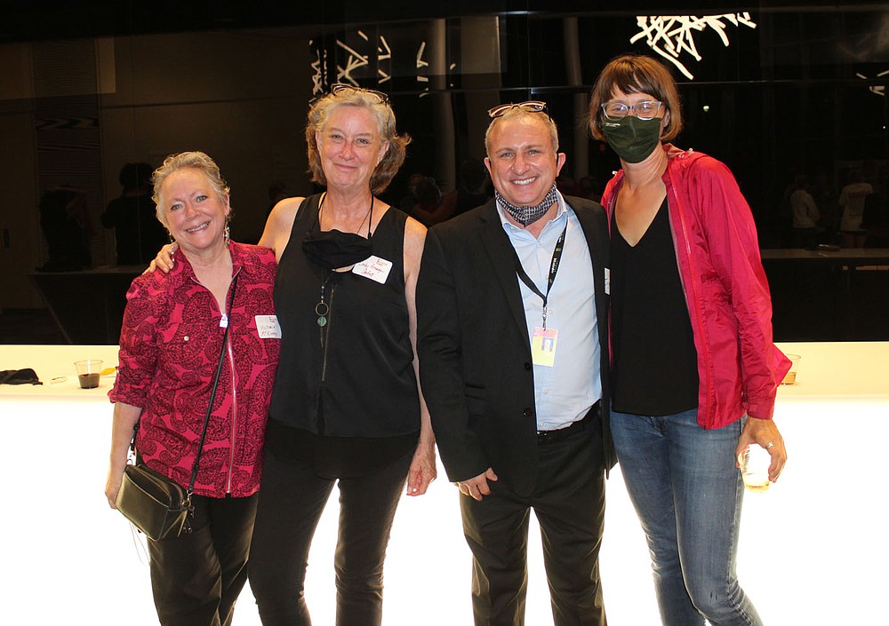 Victoria McKinney (from left), Cindy Arsaga, Jason Smith and Dea Self visit at the regional art exhibition Sept. 30 at the Walton Arts Center.
(NWA Democrat-Gazette/Carin Schoppmeyer)