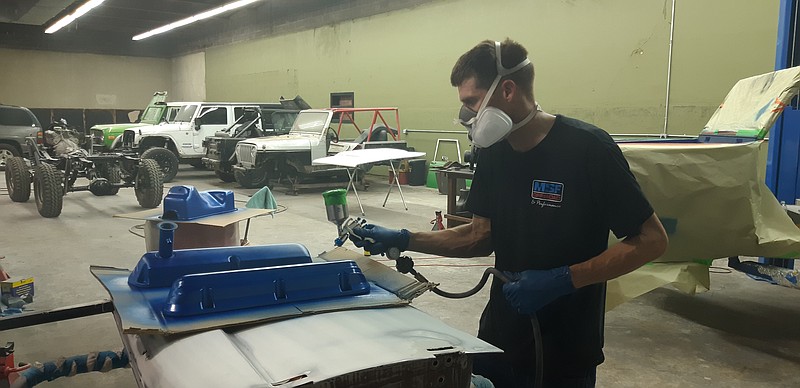 Kurt Wright, one of the technicians at MSF Offroad & Performance, works on a ground-up restoration of a 1973 Bronco. Technicians at MSF come with a wide range of skill sets and experiences, capable of both standard auto work as well as various specialized customization jobs. (Staff photo by Junius Stone)