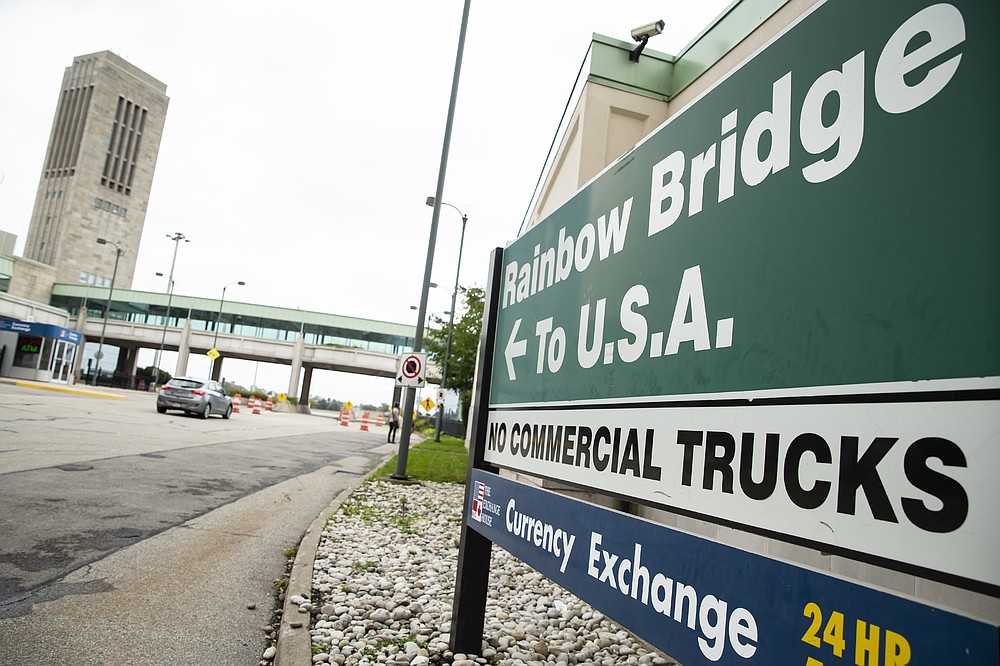 A vehicle crosses the International Rainbow Bridge from Niagara Falls, Ont. into Niagara Falls, N.Y. on Wednesday, Oct. 13, 2021. The U.S. will reopen its land borders to nonessential travel next month, ending a 19-month freeze due to the COVID-19 pandemic as the country moves to require all international visitors to be vaccinated against the coronavirus. The new rules, to be announced Wednesday, Oct. 13, 2021 will allow fully vaccinated foreign nationals to enter the U.S. regardless of the reason for travel. (Aaron Lynett/The Canadian Press via AP)
