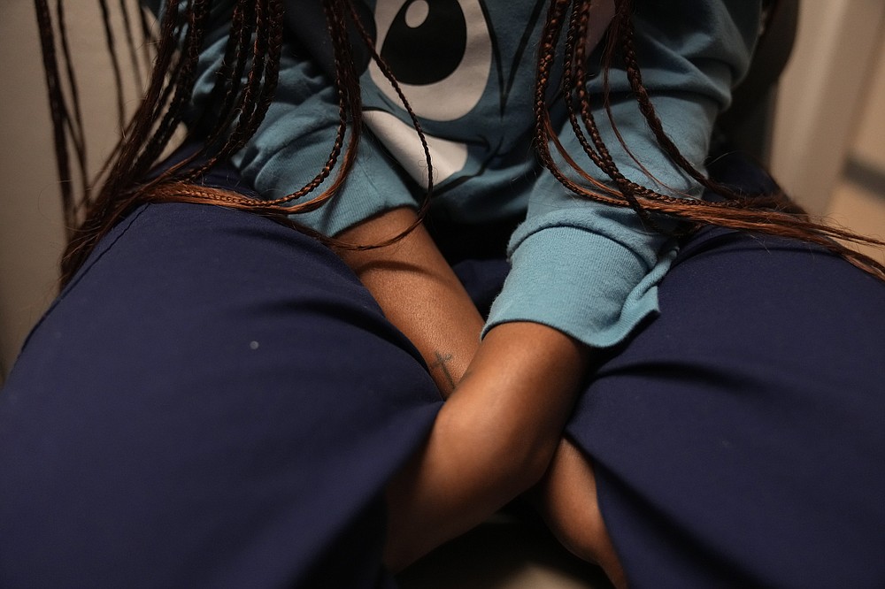 A 33-year-old mother of three from central Texas waits to get the all clear from medical staff to leave after getting an abortion, Saturday, Oct. 9, 2021, at Hope Medical Group for Women in Shreveport, La. The woman was one of more than a dozen patients who arrived at the abortion clinic, mostly from Texas, where the nation's most restrictive abortion law remains in effect. (AP Photo/Rebecca Blackwell)