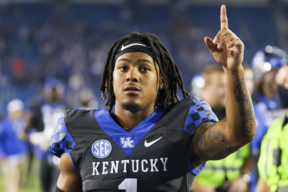 Kentucky wide receiver Wan'Dale Robinson acknowledges fans while walking off the field after the team's NCAA college football game against LSU in Lexington, Ky., Saturday, Oct. 9, 2021. (AP Photo/Michael Clubb)
