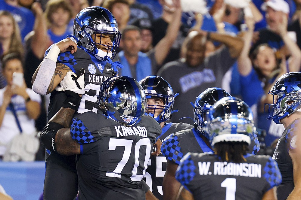 Kentucky running back Chris Rodriguez Jr., left, celebrates his touchdown during the first half of the team's NCAA college football game against LSU in Lexington, Ky., Saturday, Oct. 9, 2021. (AP Photo/Michael Clubb)